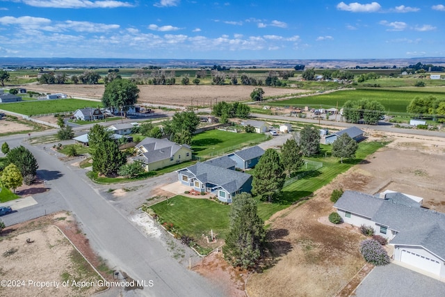 birds eye view of property with a rural view