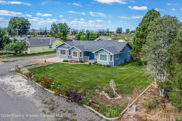 ranch-style home with a front lawn