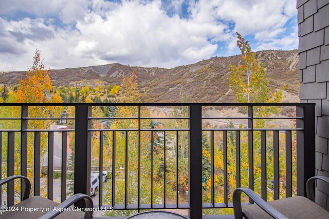 balcony featuring a mountain view