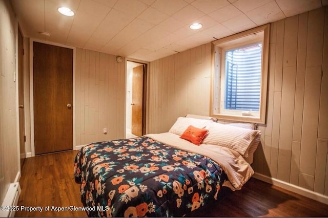 681 S 2nd St Unit G, Carbondale, CO 81623 - bedroom featuring wood finished floors, wood walls, a baseboard heating unit, and recessed lighting