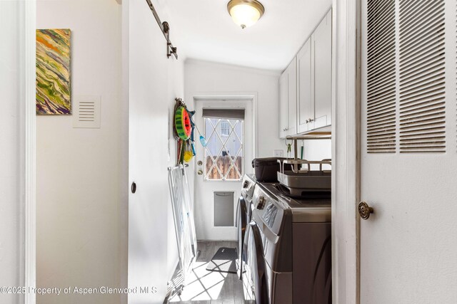 68 E Bonanza Pl, Parachute, CO 81635 - laundry area featuring a heating unit, cabinet space, and separate washer and dryer