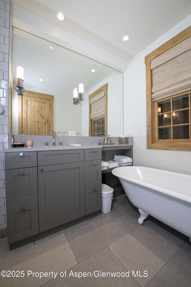 1207 Hooks Spur Rd, Basalt, CO 81621 - bathroom featuring a soaking tub, vanity, and recessed lighting