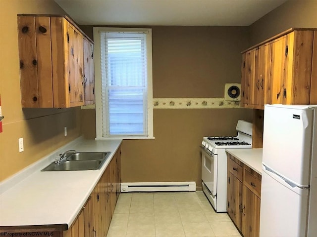 kitchen featuring a baseboard radiator, white appliances, sink, and light tile floors