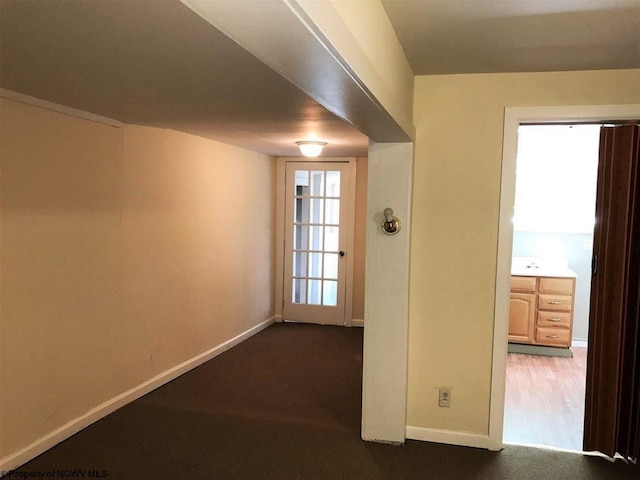 spare room featuring dark hardwood / wood-style flooring