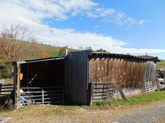 view of horse barn featuring an outdoor structure