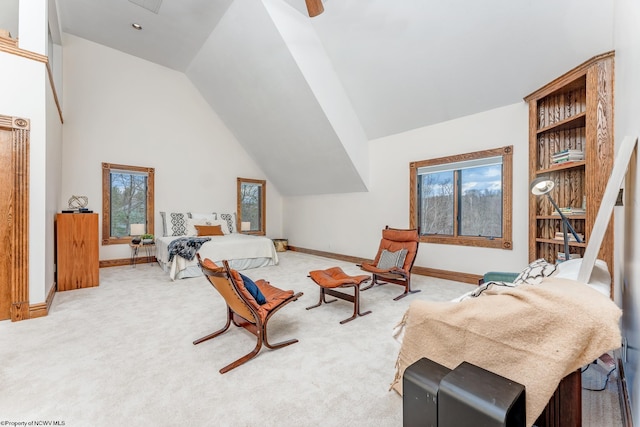 living area featuring light carpet and high vaulted ceiling