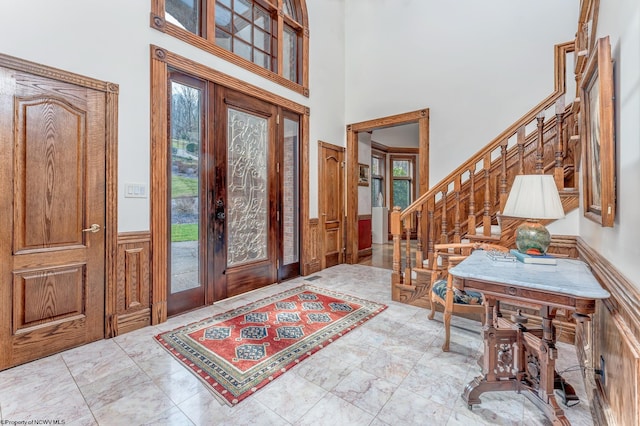 foyer entrance with a high ceiling