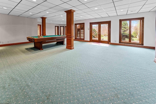 playroom with decorative columns, carpet flooring, a drop ceiling, and french doors