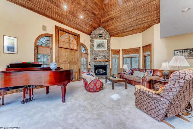 living room featuring carpet, plenty of natural light, wooden ceiling, and high vaulted ceiling