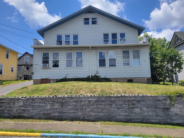 bungalow with a front yard