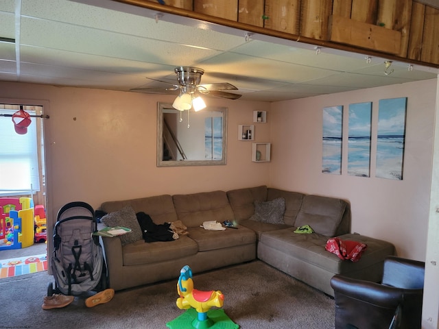 living room featuring carpet flooring and ceiling fan