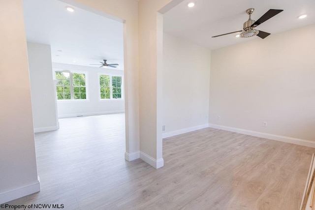 spare room with ceiling fan and light hardwood / wood-style flooring