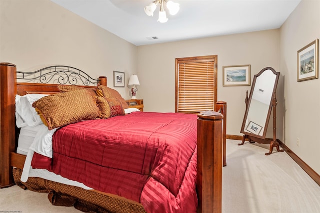 bedroom with light colored carpet