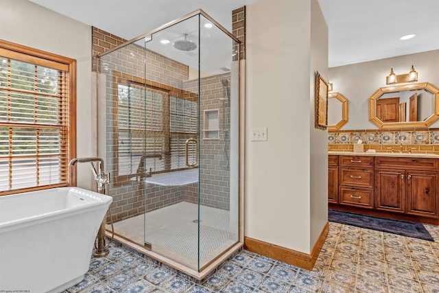 bathroom featuring separate shower and tub, tile floors, vanity, and tasteful backsplash