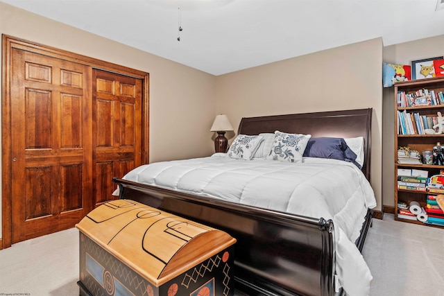 carpeted bedroom with a closet