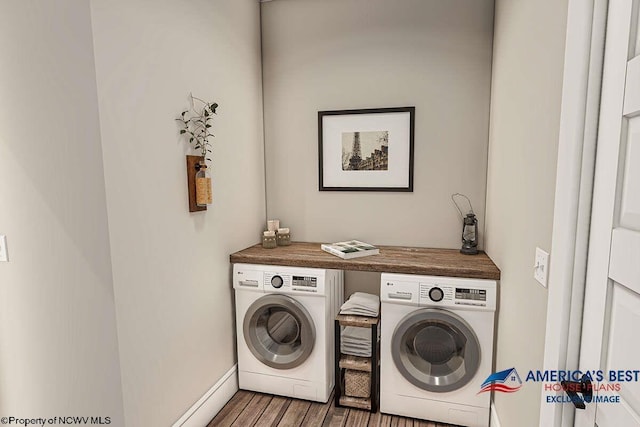 laundry room featuring separate washer and dryer and dark hardwood / wood-style floors