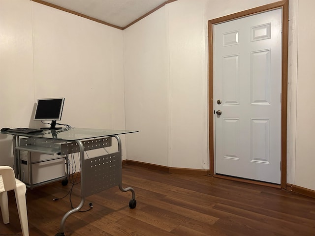 office space with dark wood-type flooring and ornamental molding