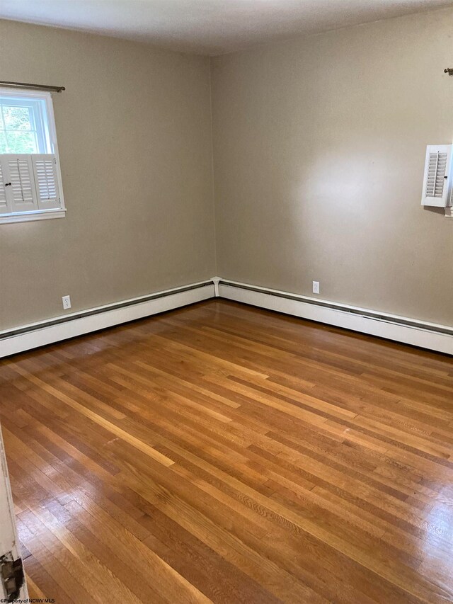 unfurnished room featuring wood-type flooring