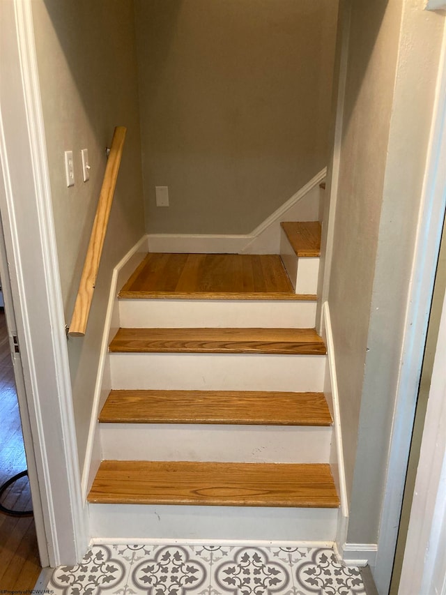 staircase with tile flooring