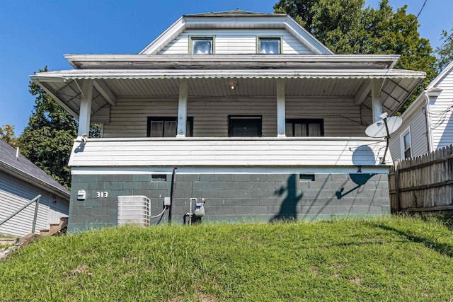 view of property exterior featuring central AC unit and a yard