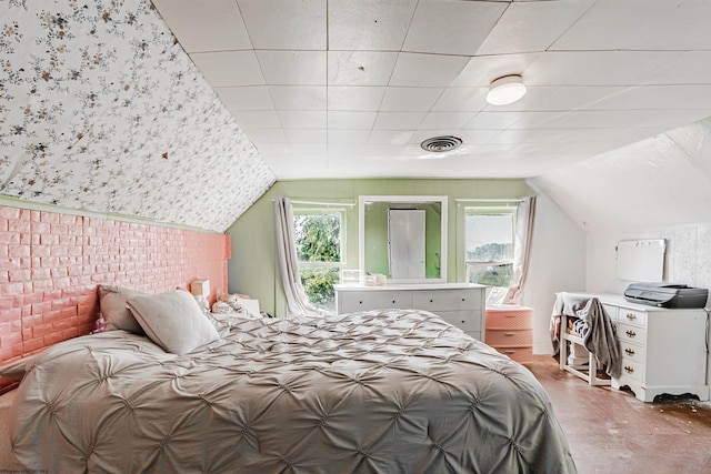 bedroom with lofted ceiling