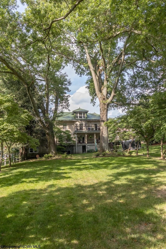 view of yard with a wooden deck