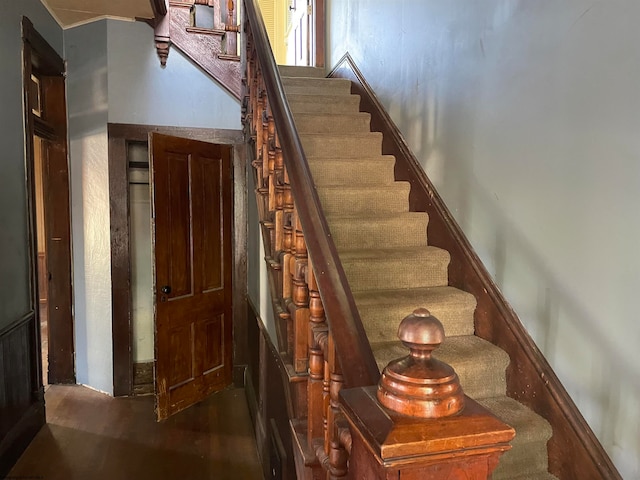 stairway featuring wood-type flooring