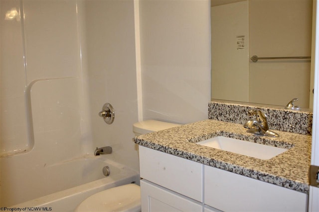 full bathroom with toilet, washtub / shower combination, and vanity