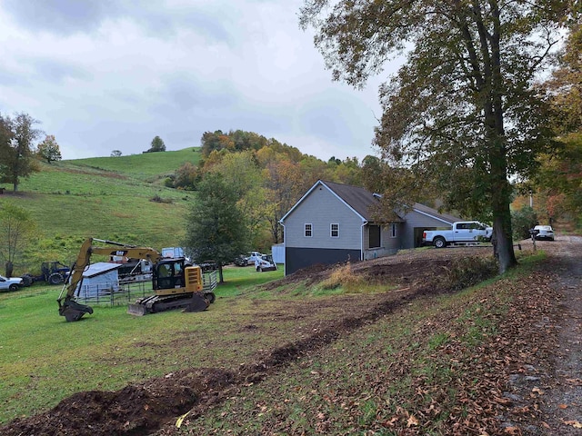 583 Gallop Run Rd, Lost Creek, WV 26385 - view of property exterior with a lawn and a rural view
