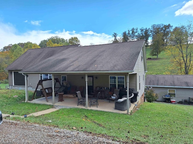 583 Gallop Run Rd, Lost Creek, WV 26385 - back of property with a lawn and a patio area