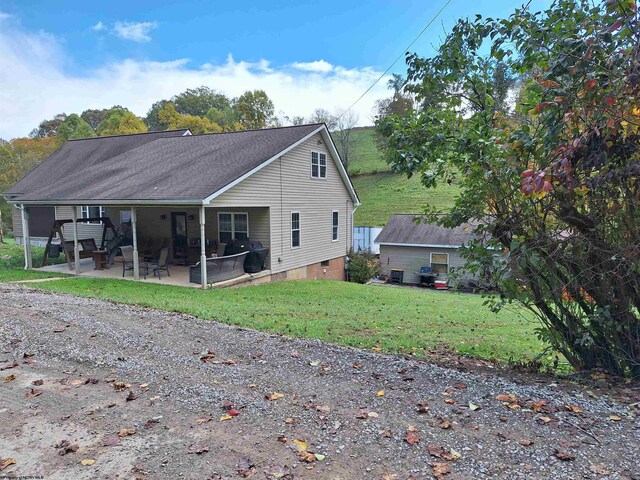 583 Gallop Run Rd, Lost Creek, WV 26385 - rear view of property featuring a yard and a patio