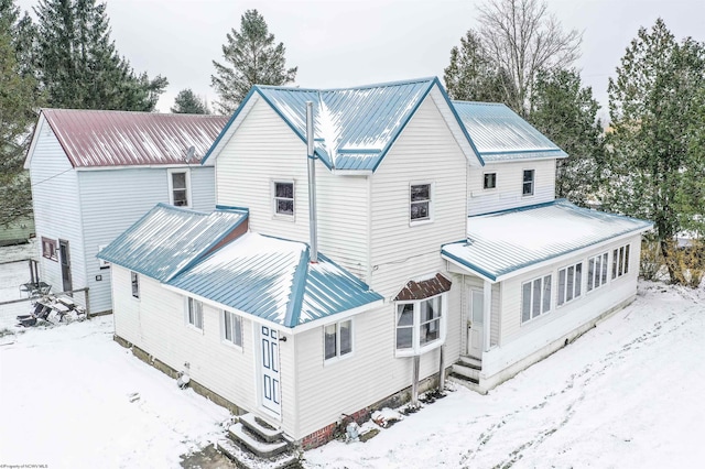 view of snow covered property