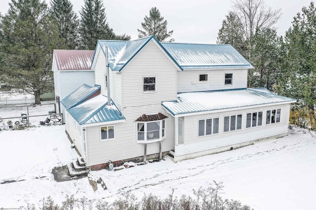 view of snow covered house