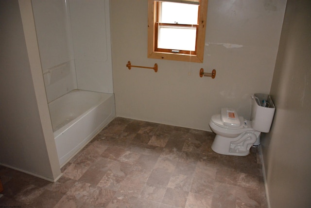 bathroom featuring tile floors, toilet, and tub / shower combination