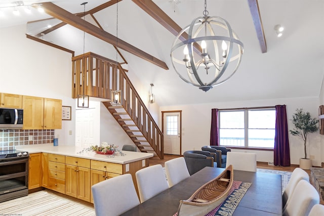 dining area featuring beam ceiling, high vaulted ceiling, light wood-type flooring, and an inviting chandelier