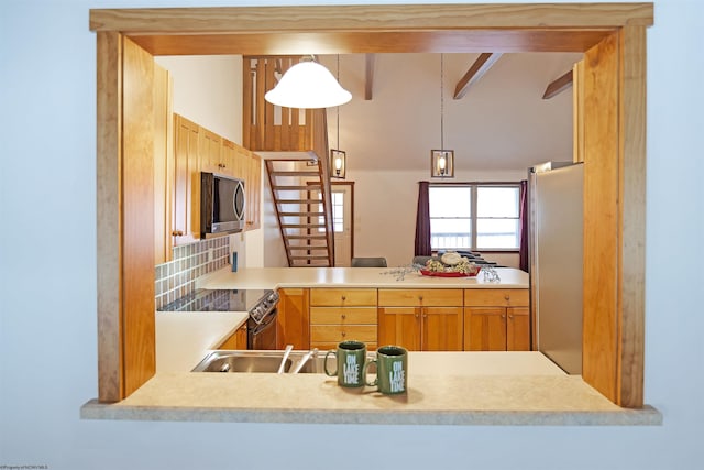 kitchen featuring stainless steel appliances, decorative light fixtures, lofted ceiling with beams, and decorative backsplash