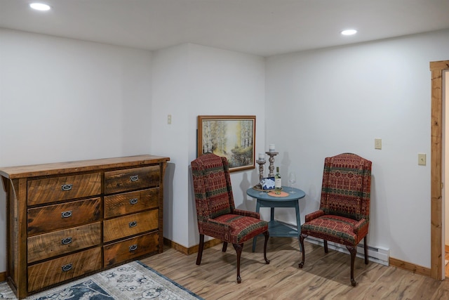 sitting room with light hardwood / wood-style flooring