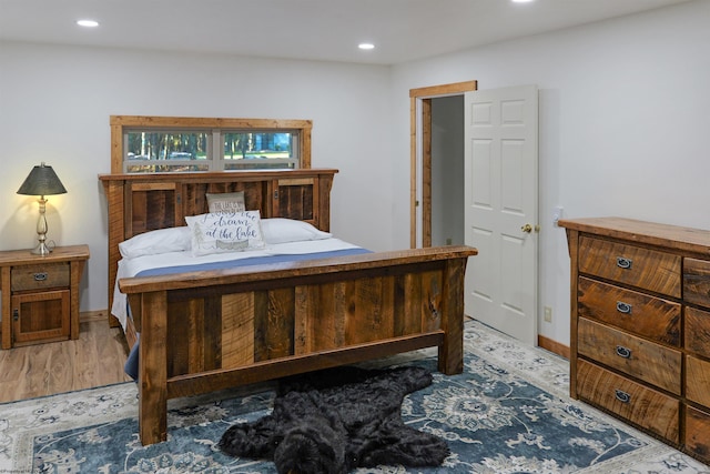 bedroom with light hardwood / wood-style floors