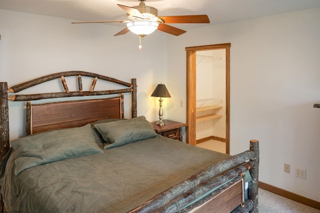 bedroom featuring light colored carpet and ceiling fan