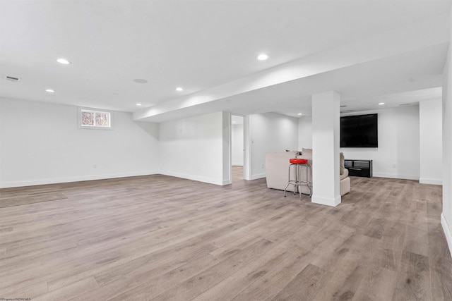 basement featuring light hardwood / wood-style flooring