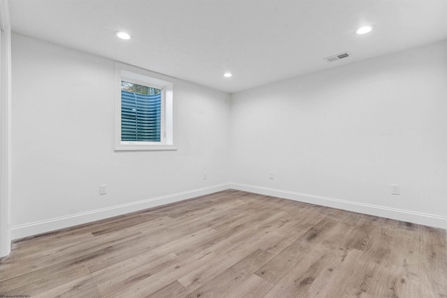 spare room with light hardwood / wood-style flooring