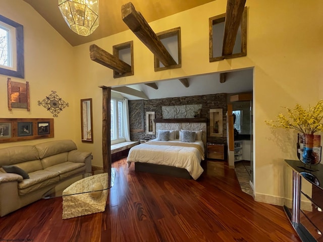 bedroom featuring a fireplace, high vaulted ceiling, dark hardwood / wood-style floors, and an inviting chandelier