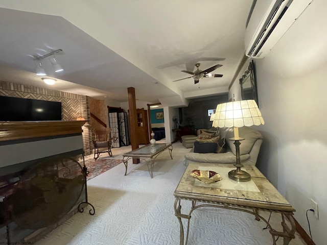 living room featuring light carpet, ceiling fan, and a wall unit AC