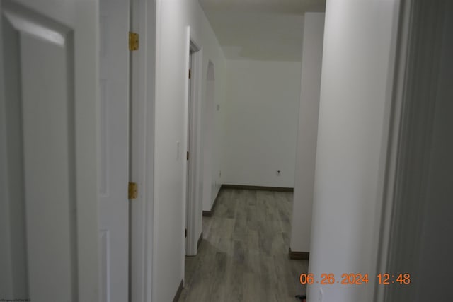 corridor featuring light hardwood / wood-style floors