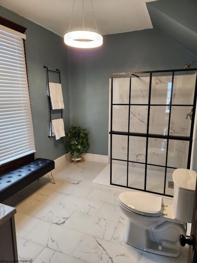 bathroom featuring a shower, vanity, and toilet