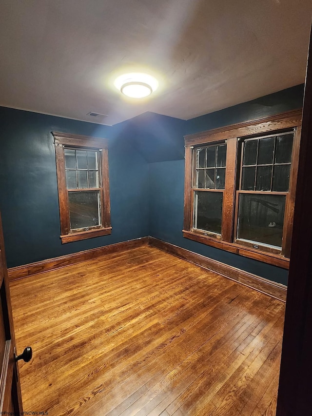 spare room featuring hardwood / wood-style floors