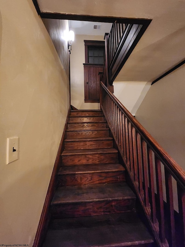 stairway with wood-type flooring