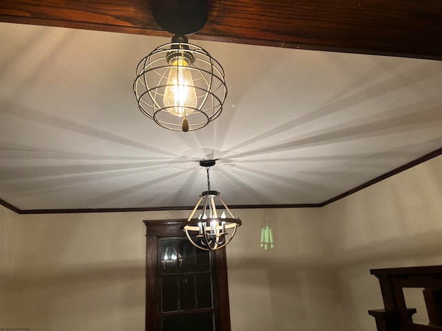 interior details with wood ceiling, crown molding, and a chandelier