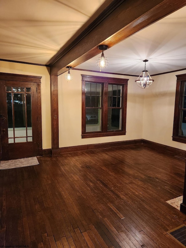 interior space with an inviting chandelier, beamed ceiling, hardwood / wood-style flooring, and ornamental molding