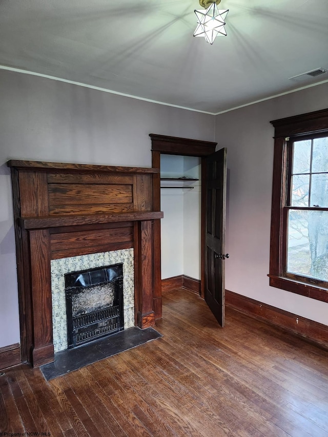 unfurnished living room featuring dark hardwood / wood-style flooring